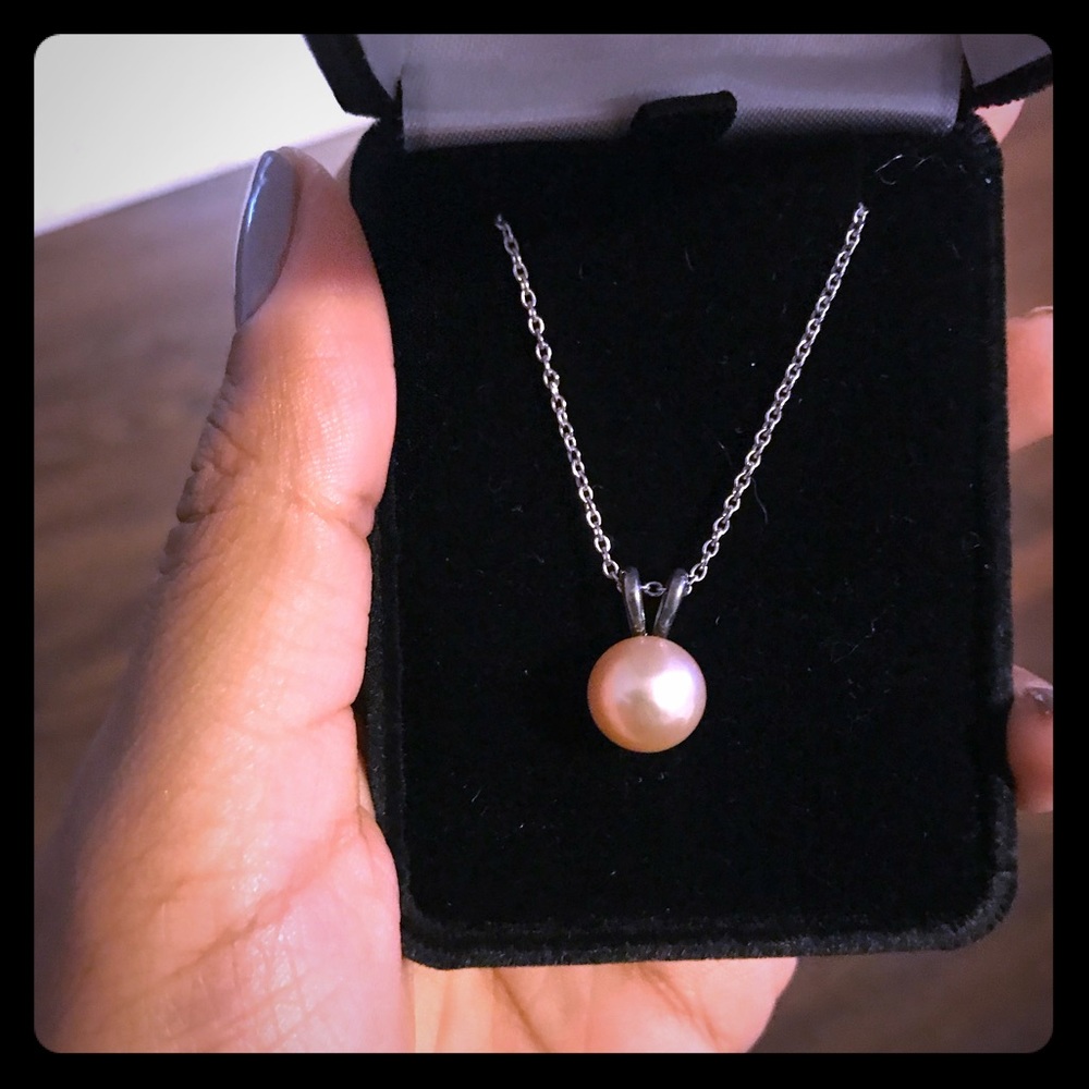 Real pearl necklace on sterling silver chain.